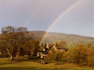 Rainbow's end in a valley