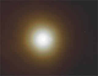 Three ringed lunar corona