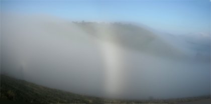 Partial fogbow in a valley