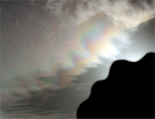 Iridescent bands following the cloud outline