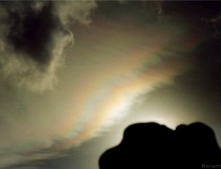Iridescent bands in thin cloud